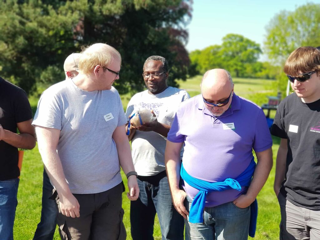 group of men holding an ingredient of fireworks