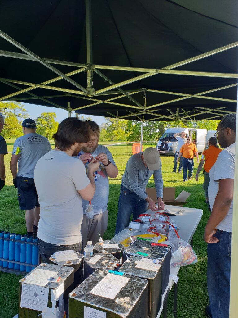 men taking in part in setting up fireworks