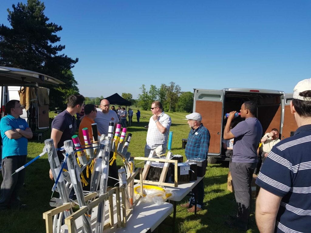 fireworks on tables being set up outdoors
