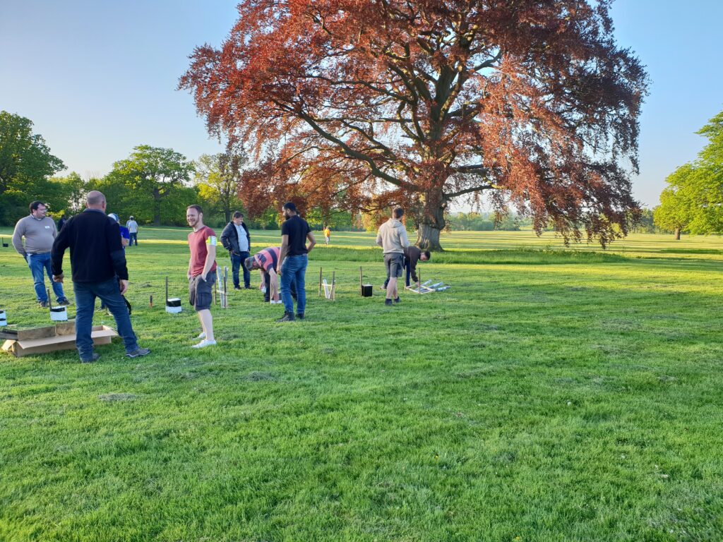 group of men participating in setting up a firework display