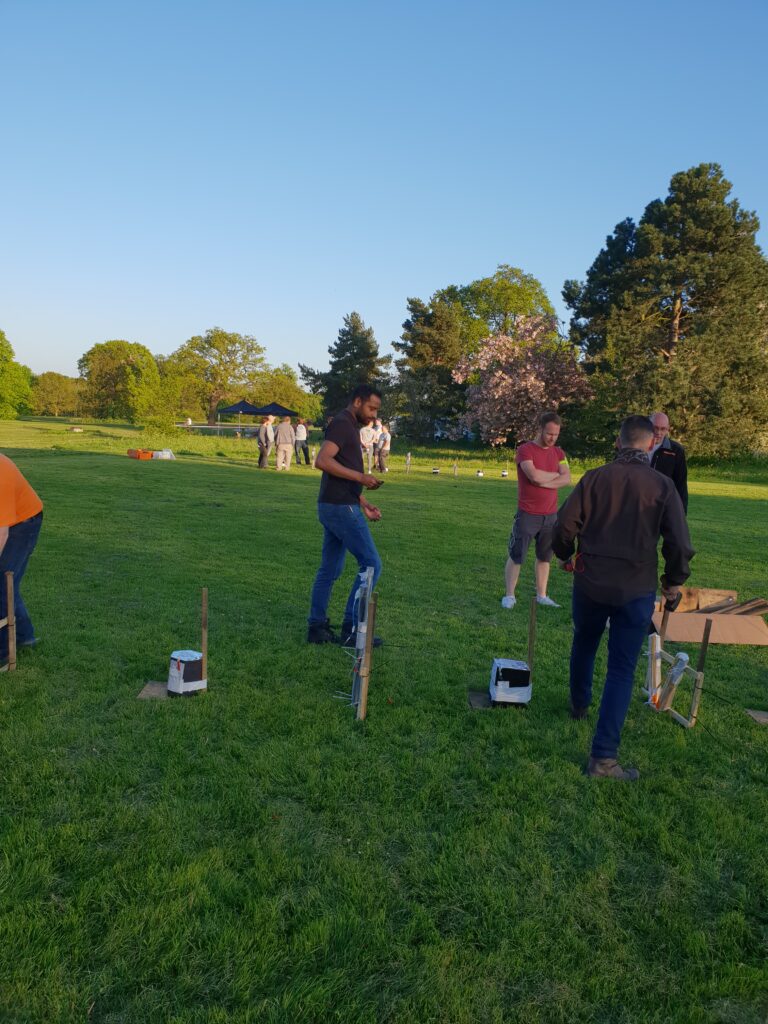 group of men setting up a row of fireworks
