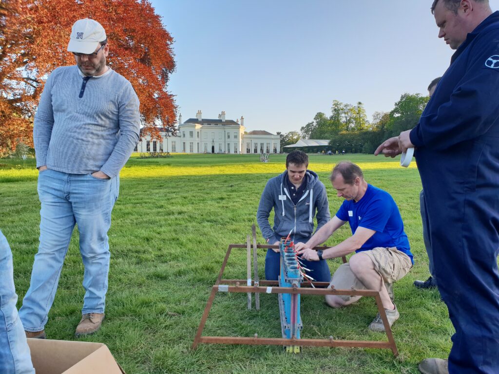 men joining in to help set up the firework displays