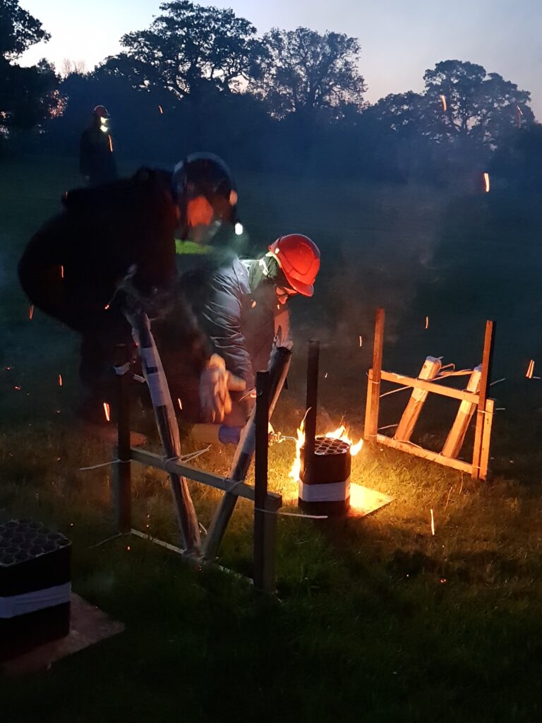 men igniting fireworks safely
