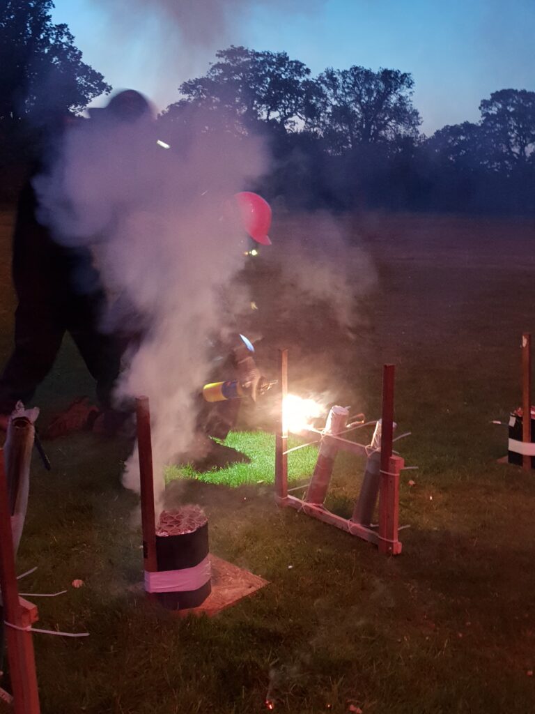 Man safely igniting fireworks