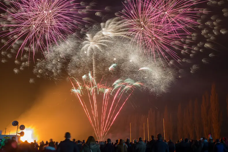 crowd watching bonfire night fireworks display