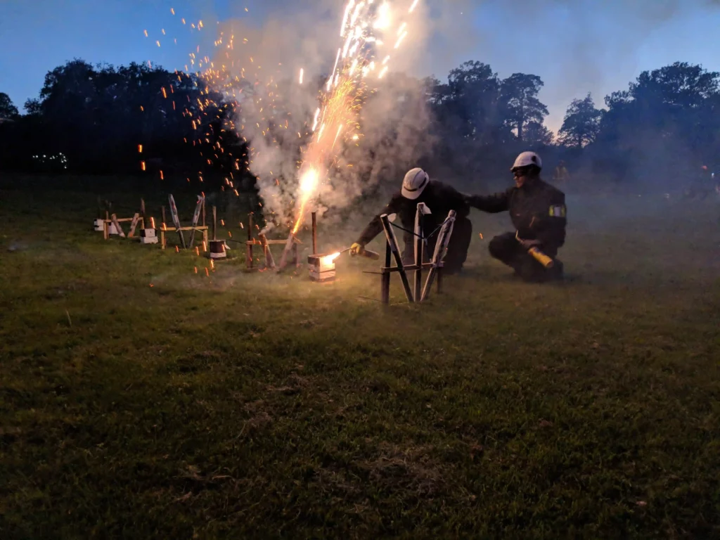 two pyrotechnician firing firework