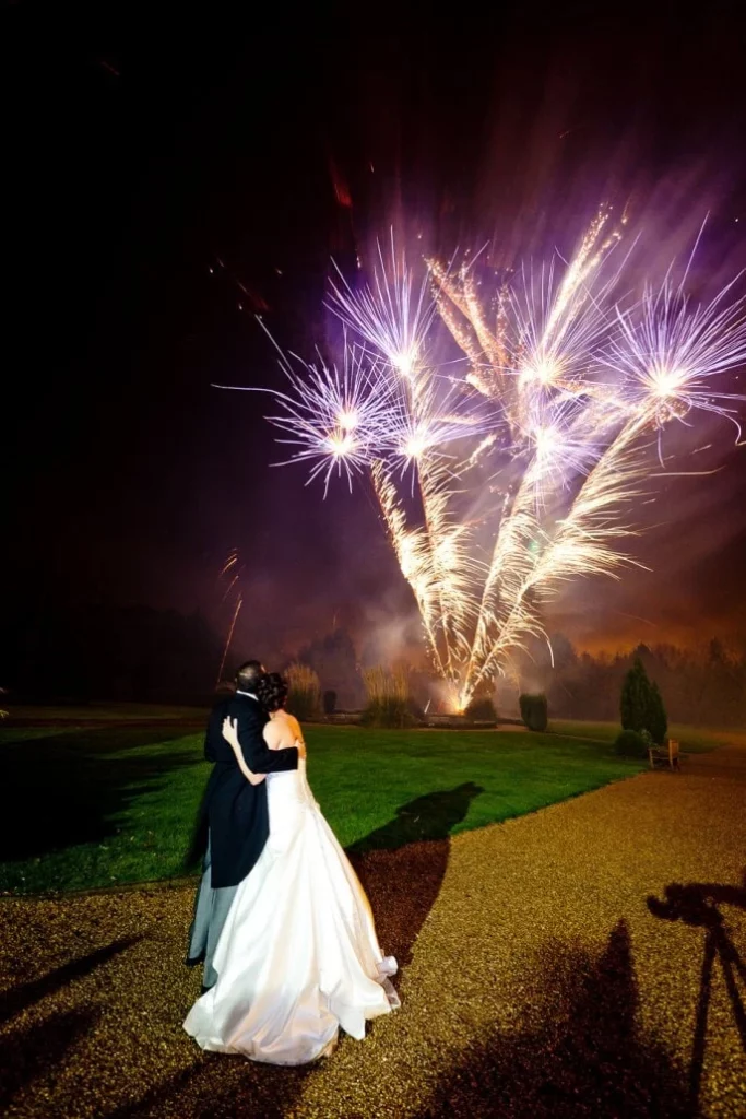 Wedding couple admiring firework display